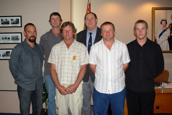 Garry Langridge and Kaipara Mayor Neil Tiller (third and fourth from left)  with Ararua Volunteer Rural Fire Force members who attended the presentation to support their Deputy Controller � from left; Troy Savage, Controller Mike Moulds, Shaun Holt and Ra